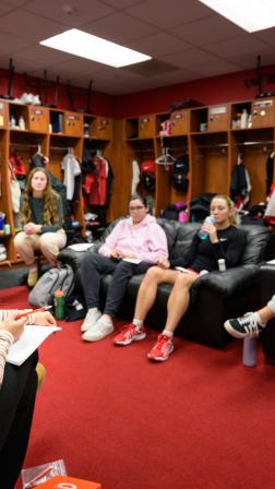 Jaya Hatlestad and Zoey Buchan lead a TOBS in their locker-room for fellow women’s basketball teammate