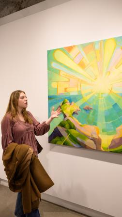 Teila shows some of her fellow InterVarsity friends her art