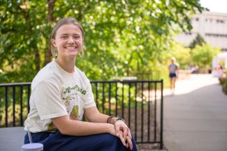 female student sitting and smiling