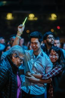 emotional hug between man making a faith decision and a woman friend