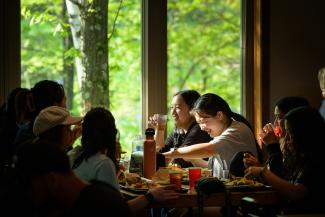 group of students eating and laughing