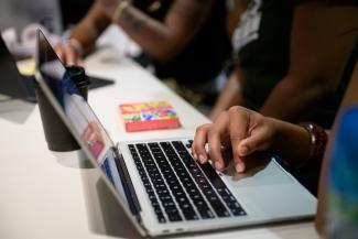 hand on a laptop keypad