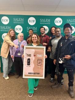 Group of students on campus with poster