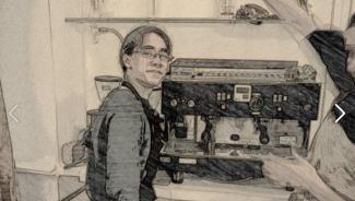 Sepia, edited photo of young man working as a barista with apron and glasses, standing in front of cappuccino machine