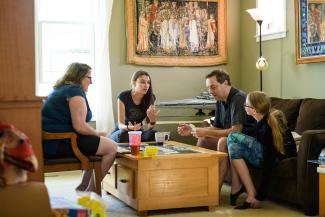 a family gathered around a coffee table