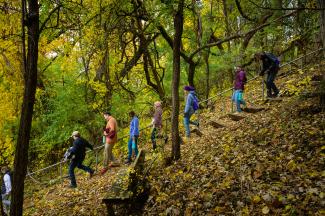 students hiking through the forest