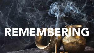 One urn turned on its side and one urn upright with stick of incense and the word "Remembering" across the image