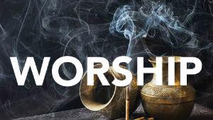 One urn turned on its side and one urn upright with stick of incense and the word "Worship" across the image