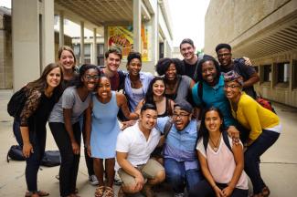 Group photo of diverse students outside on campus