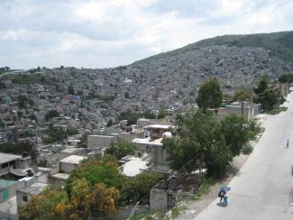 Panorama of a large city with thousands of houses filling a mountainside