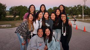 a group of Asian American students smiling at the camera