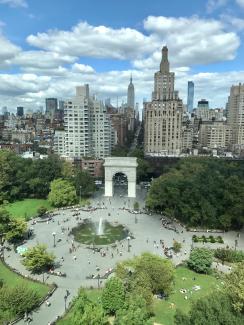 an aerial picture of the New York City skyline and NYU's campus