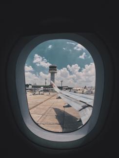 the wing of an airplane seen from inside the plane