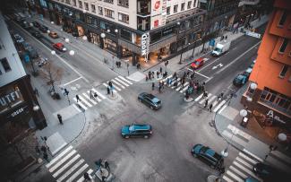 A busy four-way intersection in an urban downtown