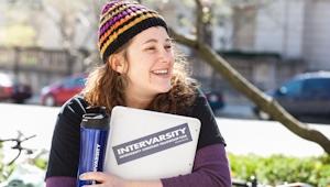 Female college student outside carrying school books