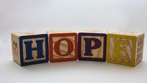 Multicolored building blocks spelling out the word "hope"