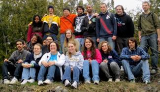 Group photo of UM-Flint chapter in forest