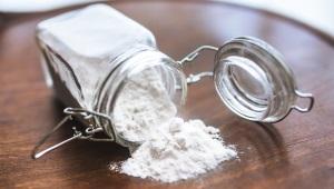 a flour jar tipped over on a table and spilling out