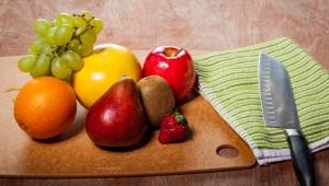 Fruit resting on a wooden table representing the fruit of the Spirit.