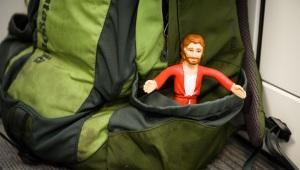 Jesus action figure stuck in backpack pocket