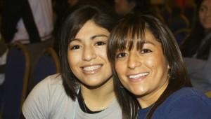 two Latina women smiling together