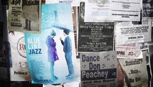Clippings of newspapers beside Blue Like Jazz Movie Poster of young man holding umbrella for young woman