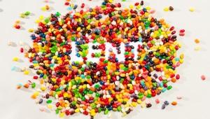 Pile of multicolored jelly beans with the word "Lent" spelled out in the middle of them