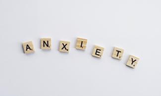 The word "Anxiety" spelled out with Scrabble letters