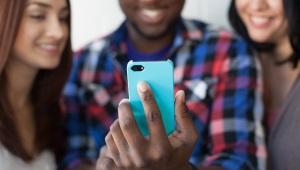 Group of three people posing for selfie