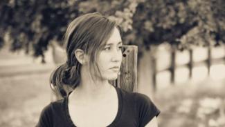 Black and white portrait of young woman looking off to the side