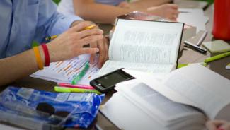 a Bible sitting open on a cluttered table