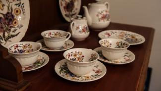 a set of fine china sitting on a table