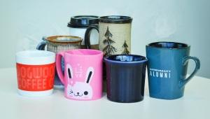 a collection of random mugs