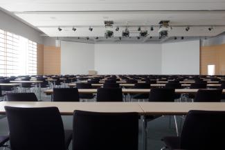 a whiteboard and chairs in an empty classroom