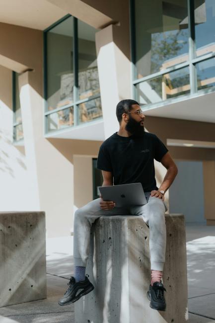 black student sitting with laptop