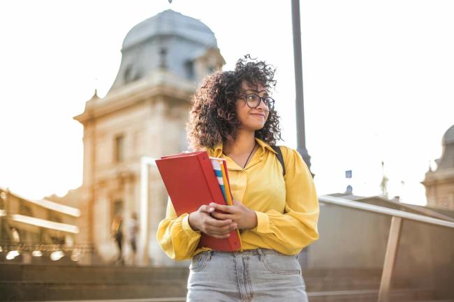 girl holding folders