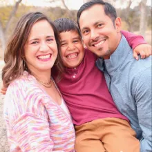 Nati, son, and husband smiling for photo