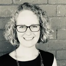 smiling woman with glasses