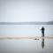 person standing alone on a lake