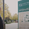 man reading sign