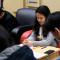 Group of Asian American students praying during Bible study