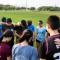 Group of Asian American students holding hands praying