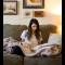 woman sitting on the couch and reading