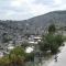 Panorama of a large city with thousands of houses filling a mountainside