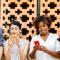 Group of people all staring at smartphones standing side by side