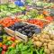 Produce section of grocery store with broad, colorful range of fruits and vegetables