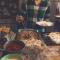 Person picking food on a tray from a Thanksgiving feast