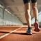 Closeup of runner's feet walking along indoor track