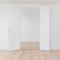 Empty rooms with plain white walls and open door