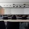 a whiteboard and chairs in an empty classroom